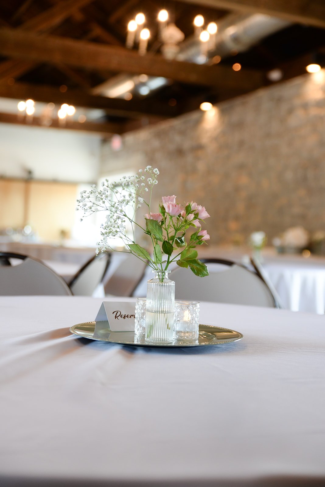 Ashley and Juli wedding reception detail with bud vase