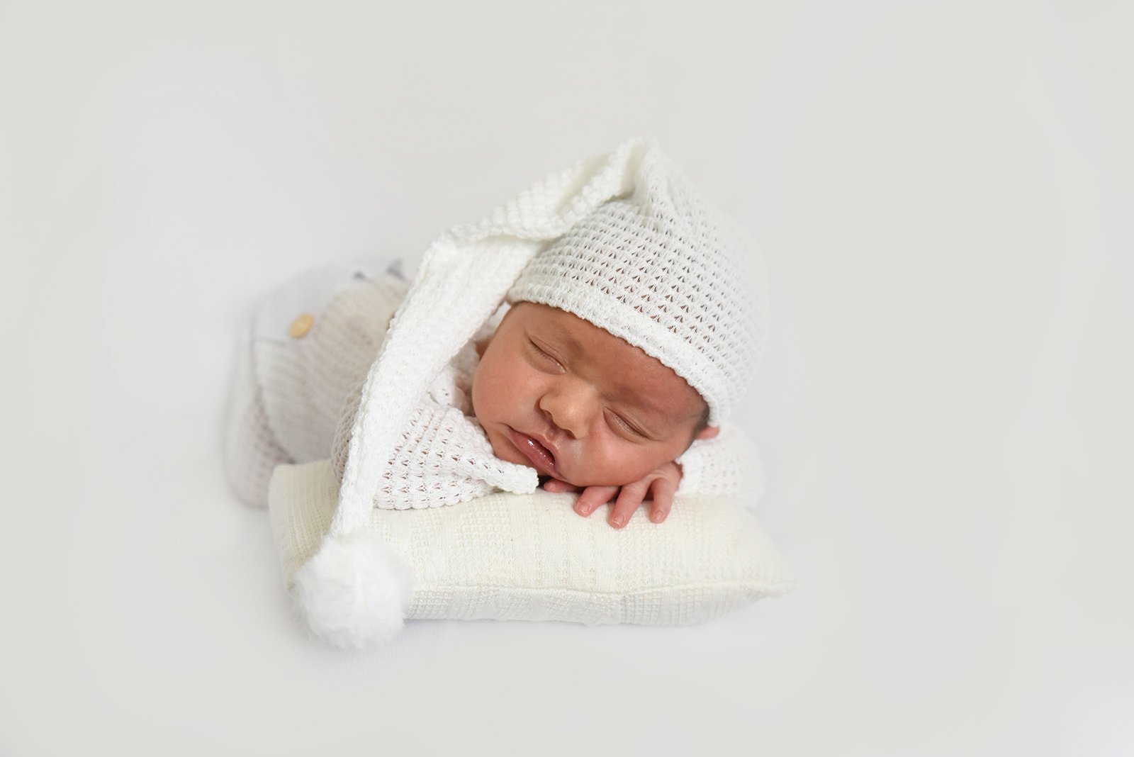 Studio newborn portrait with knit hat