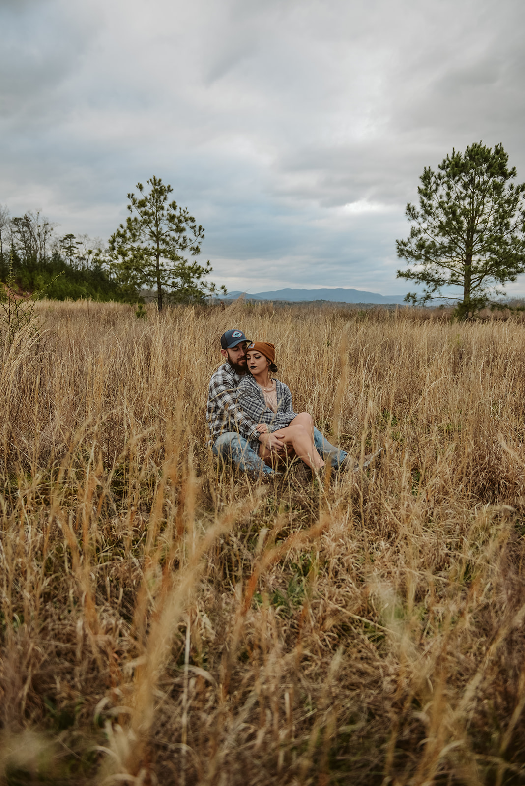 Engaged couple in mountain landscape during Ellijay Georgia engagement session in apple country
