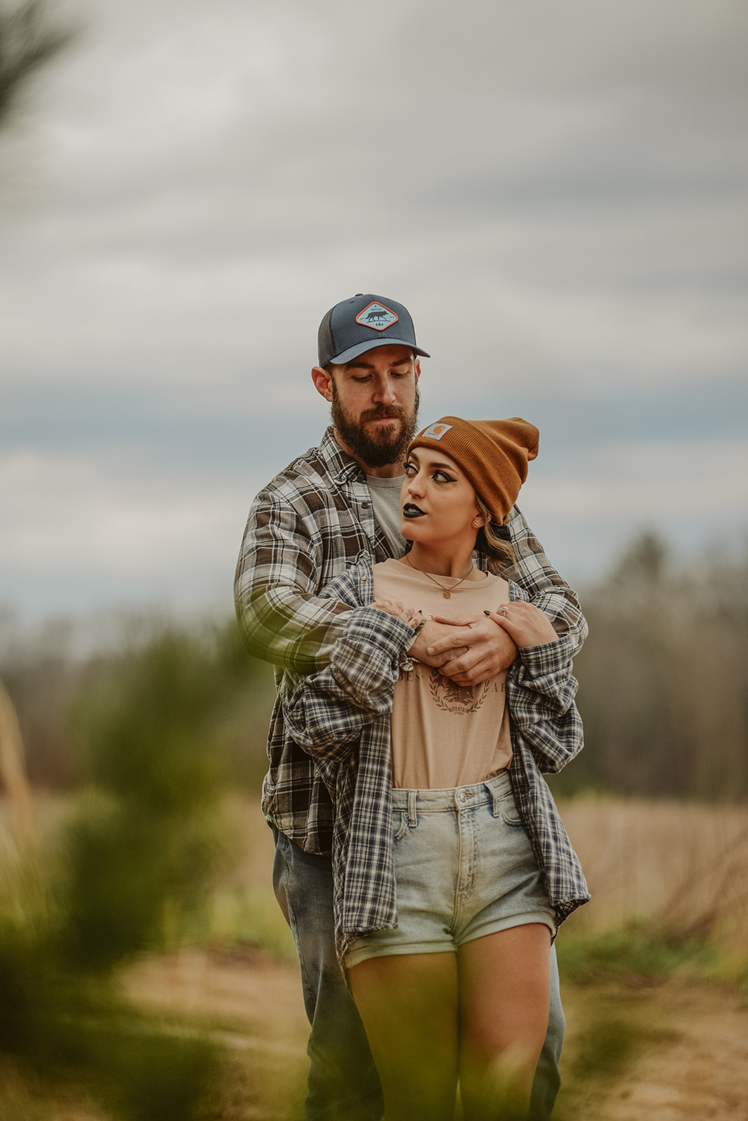 Couple holding hands at golden hour during Ellijay GA mountain engagement session