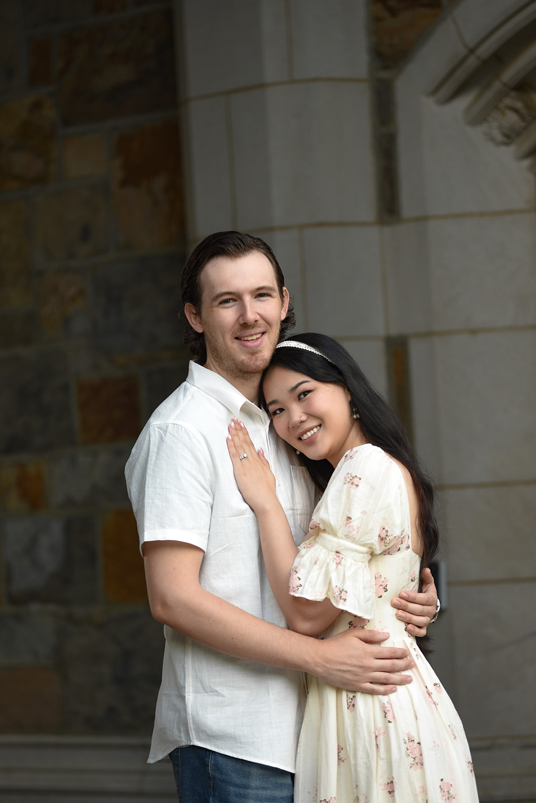Couple holding hands during outdoor engagement session in Marietta GA