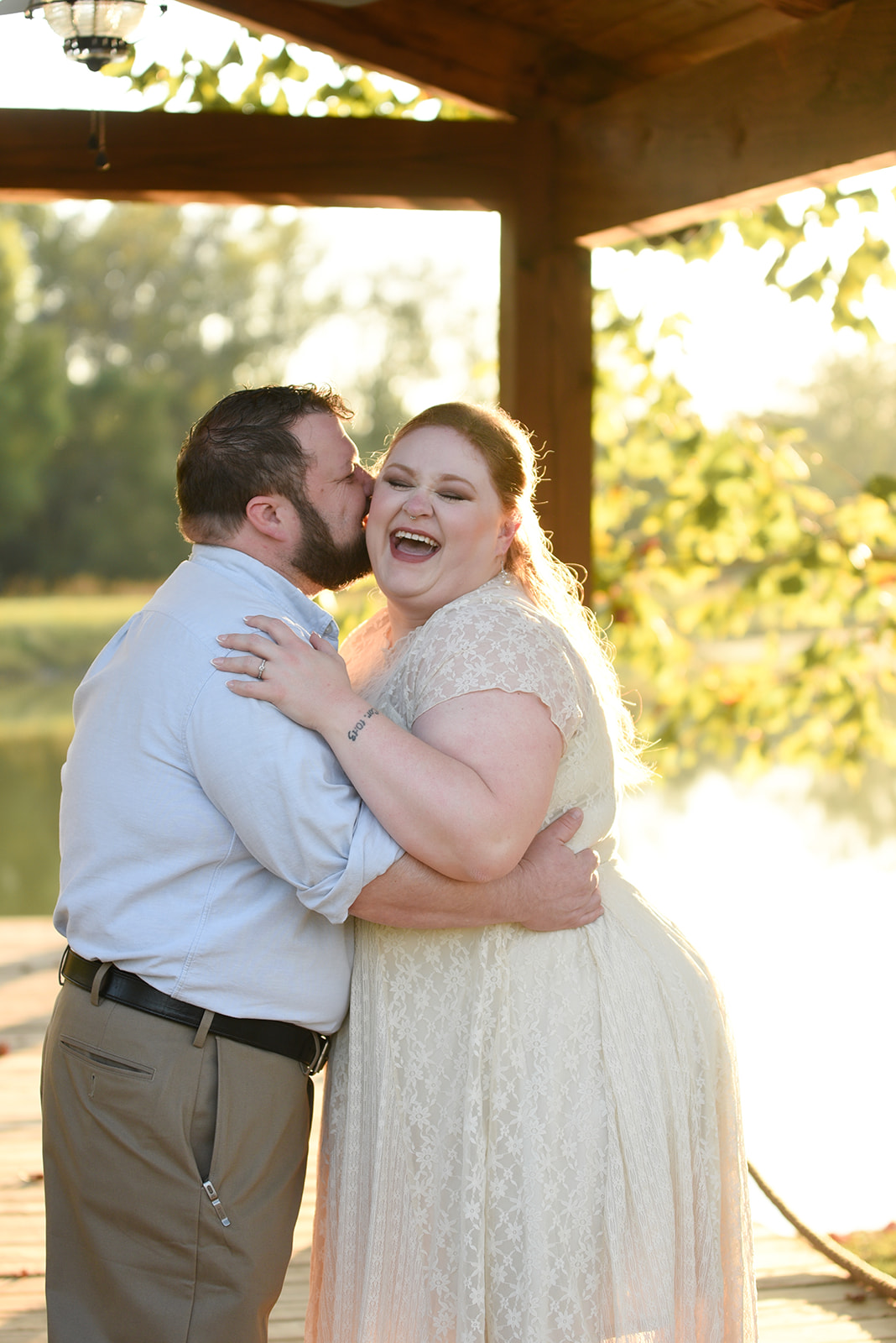 Couple in open parkland at Collins Hill Park Lawrenceville GA during engagement session
