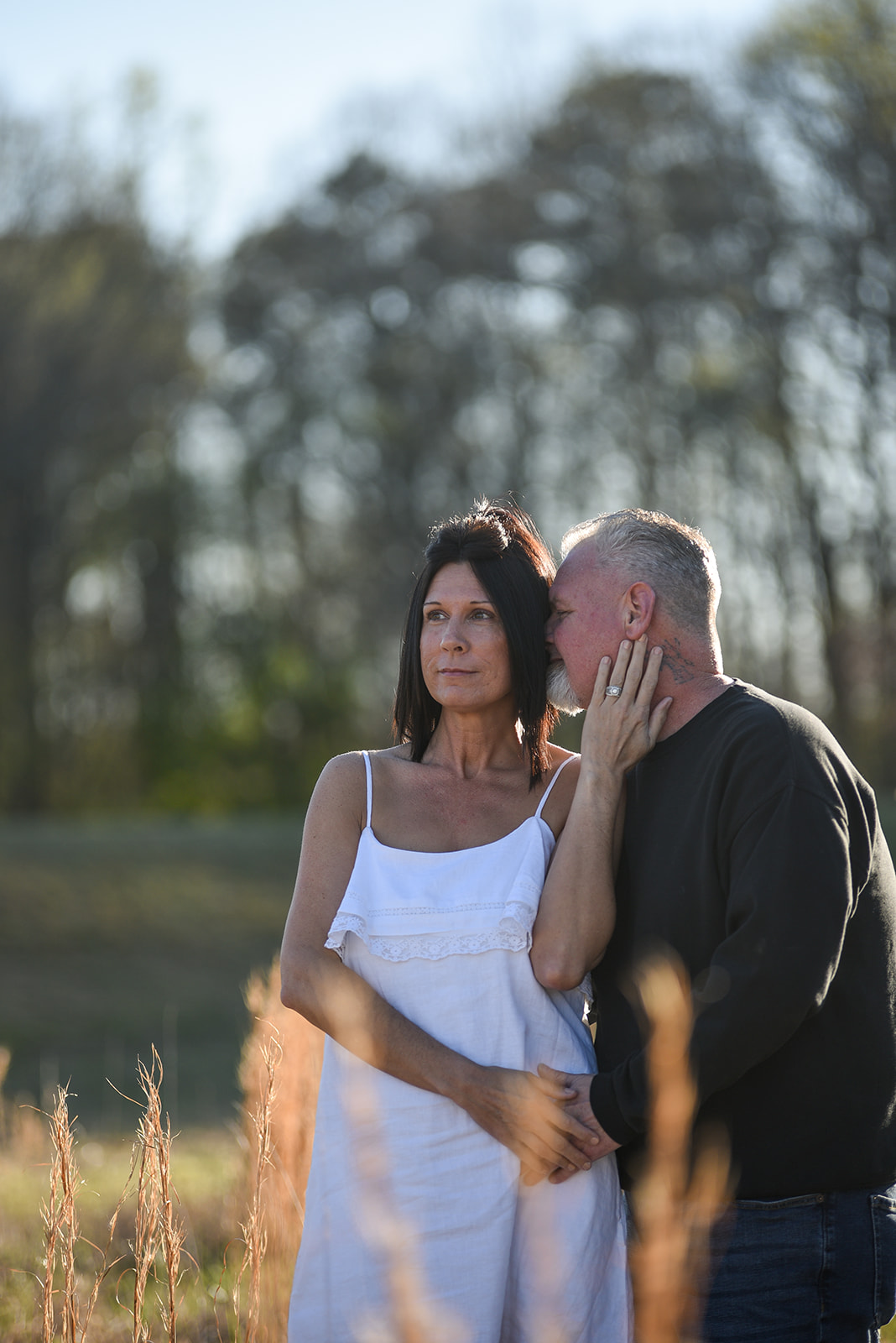 Engaged couple embracing on a lakefront dock at Lake Lanier, GA