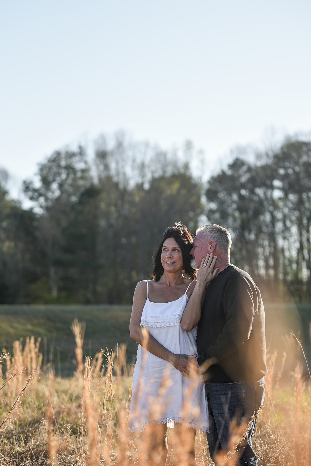 Couple holding hands at sunset during Sandy Springs Fulton County engagement session