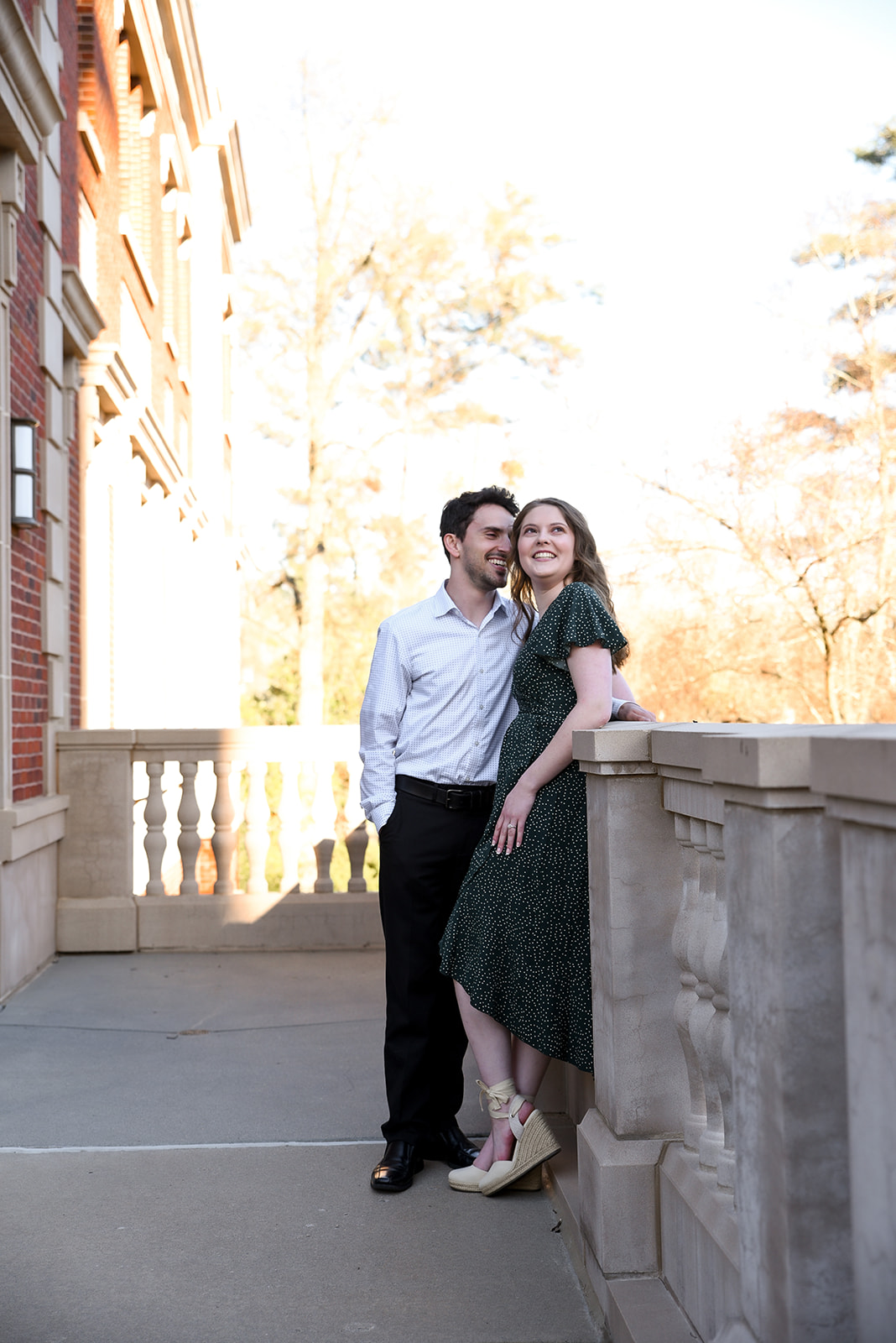 Couple in warm autumn light in apple orchard Cornelia Georgia engagement session