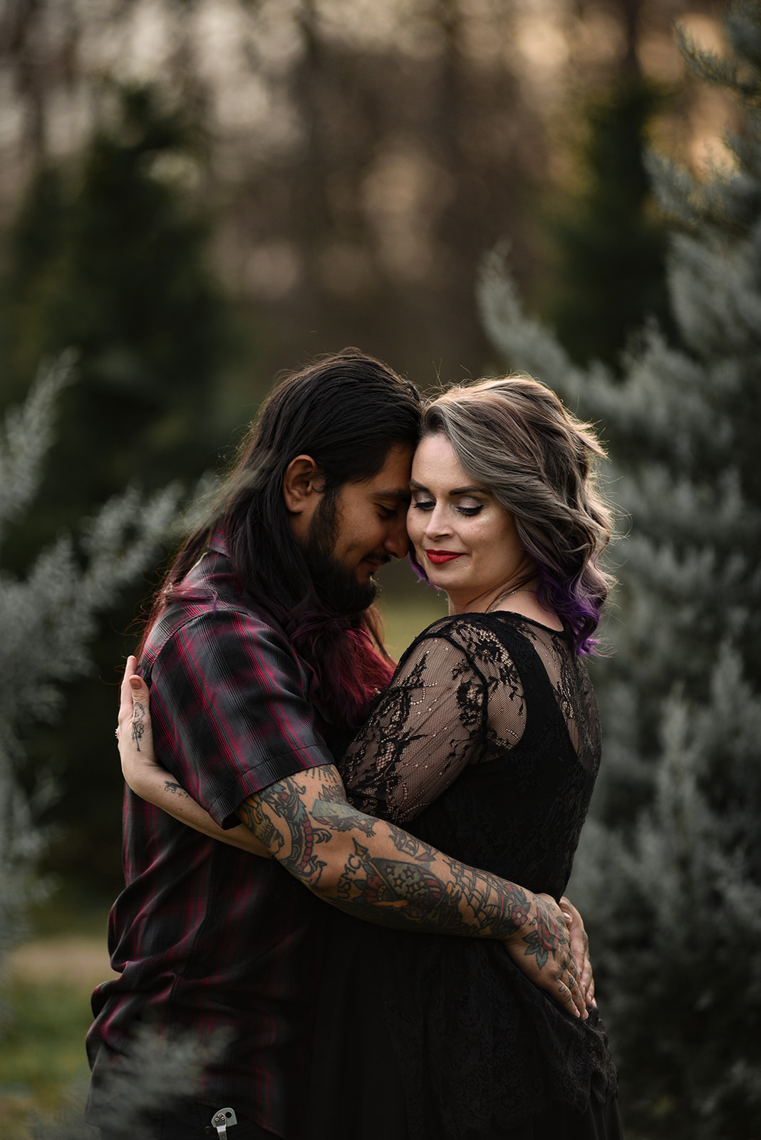 Engaged couple walking through a mountain meadow near Dahlonega, GA during fall foliage