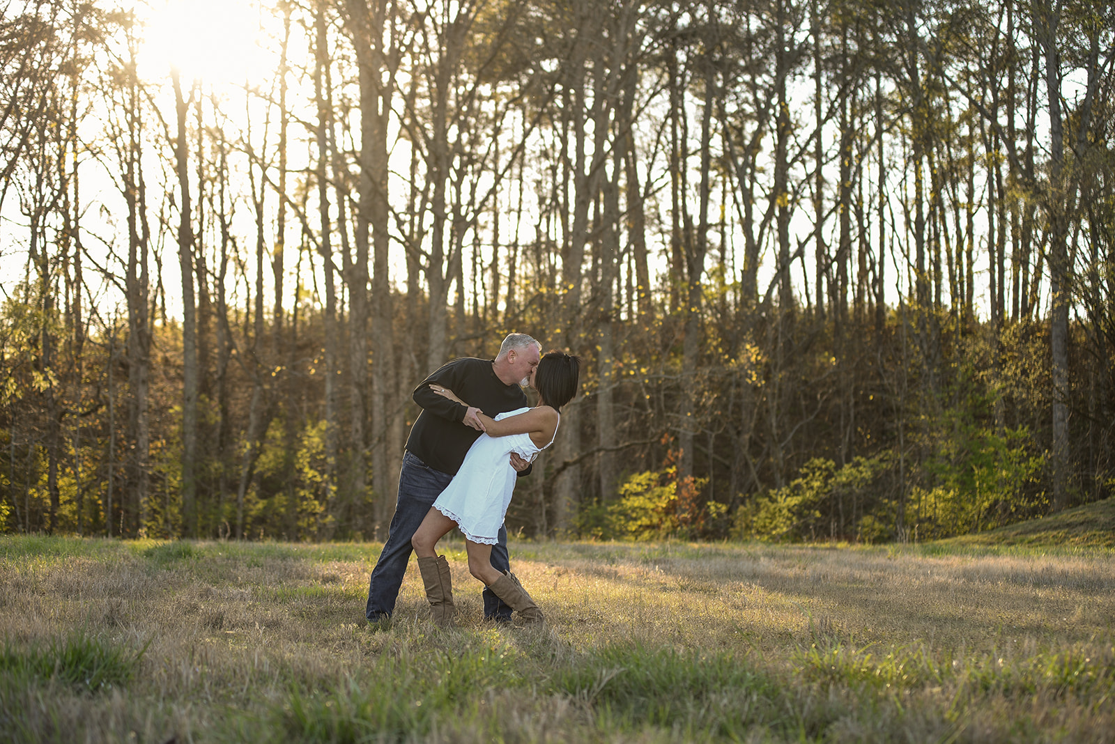Couple in elegant outfits during Covington Georgia historic engagement session in spring