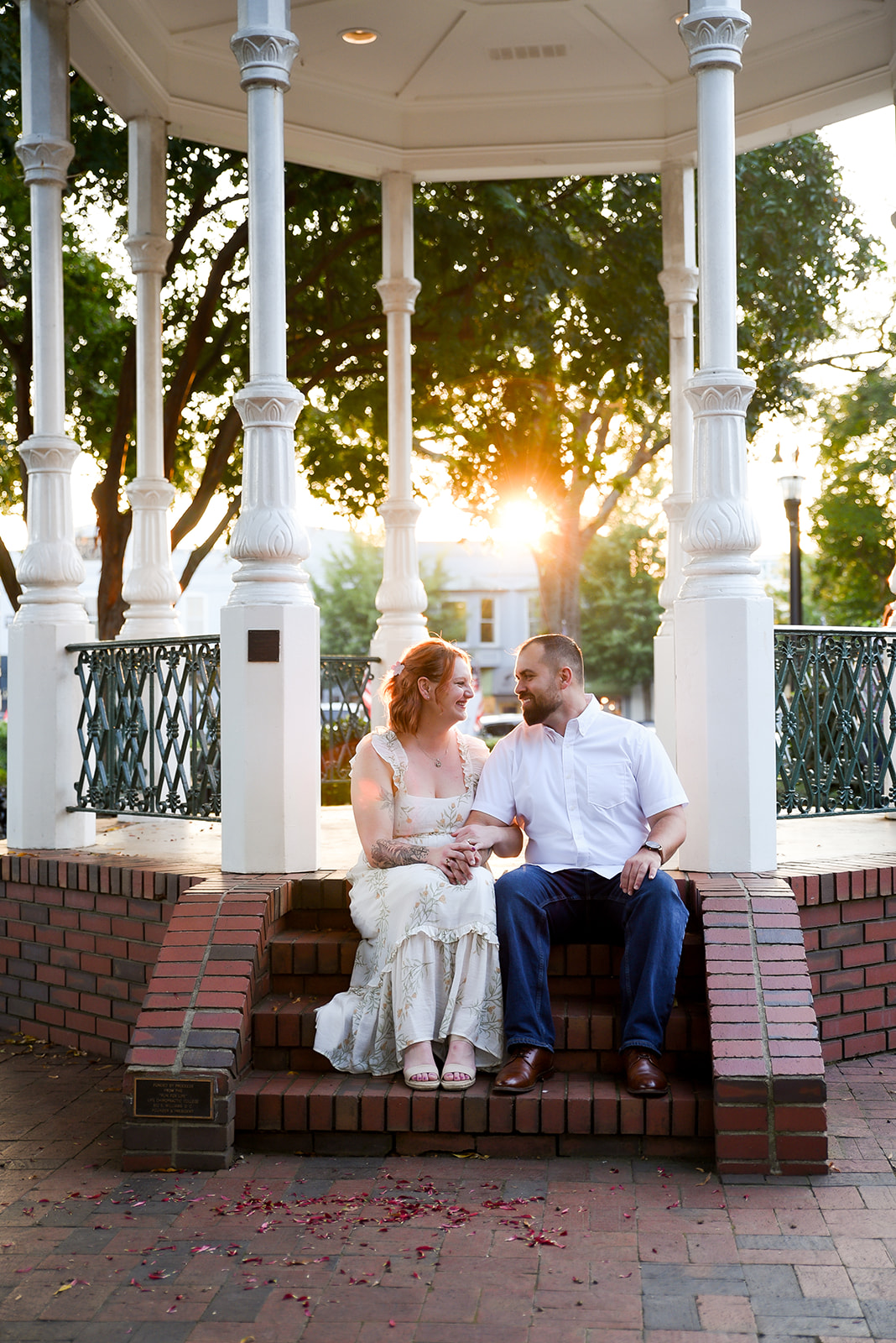 Engagement portrait in orchard setting near Cornelia GA with Blue Ridge mountain backdrop