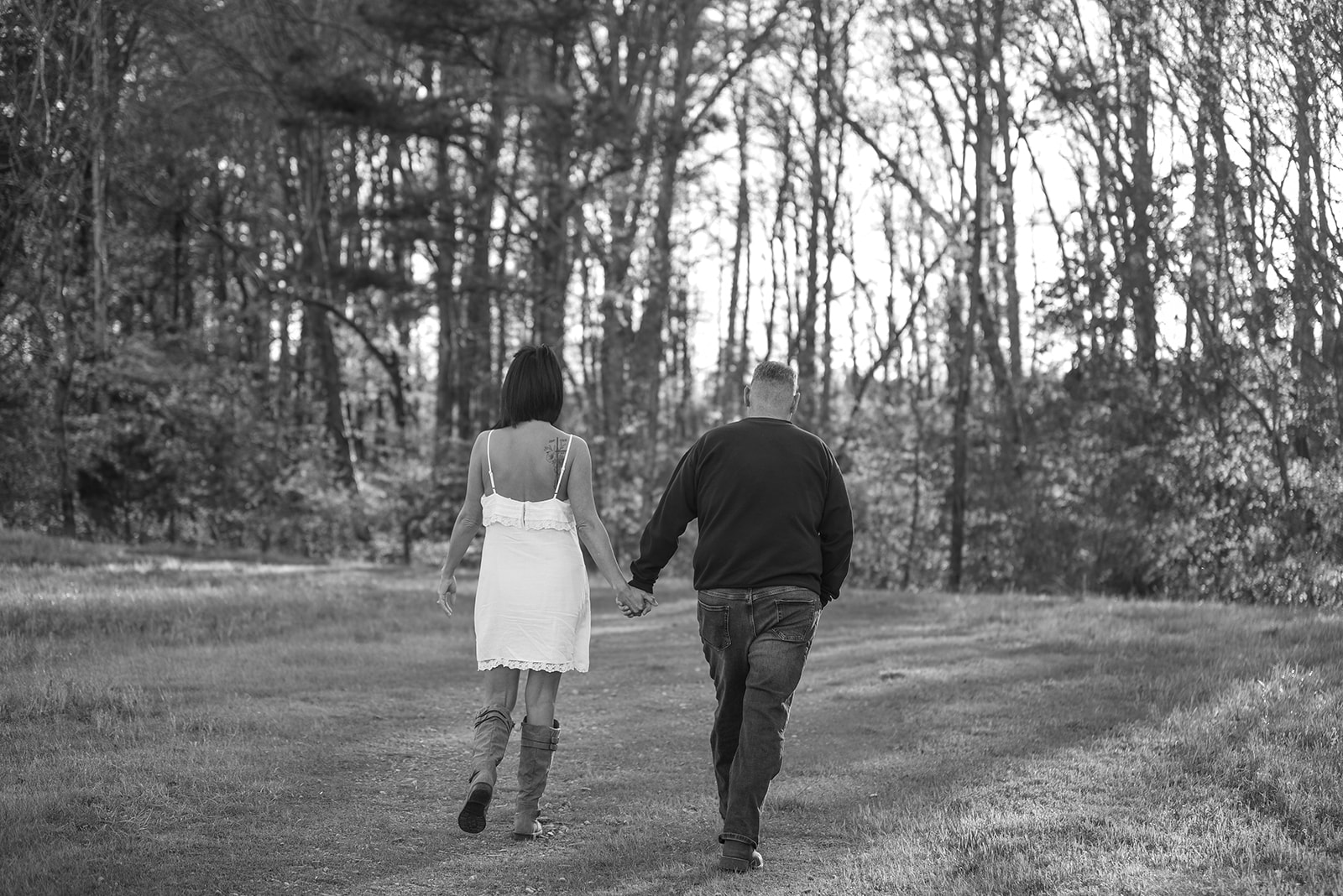 Engaged couple at sunset in Suwanee Georgia, warm golden light in park setting Gwinnett County