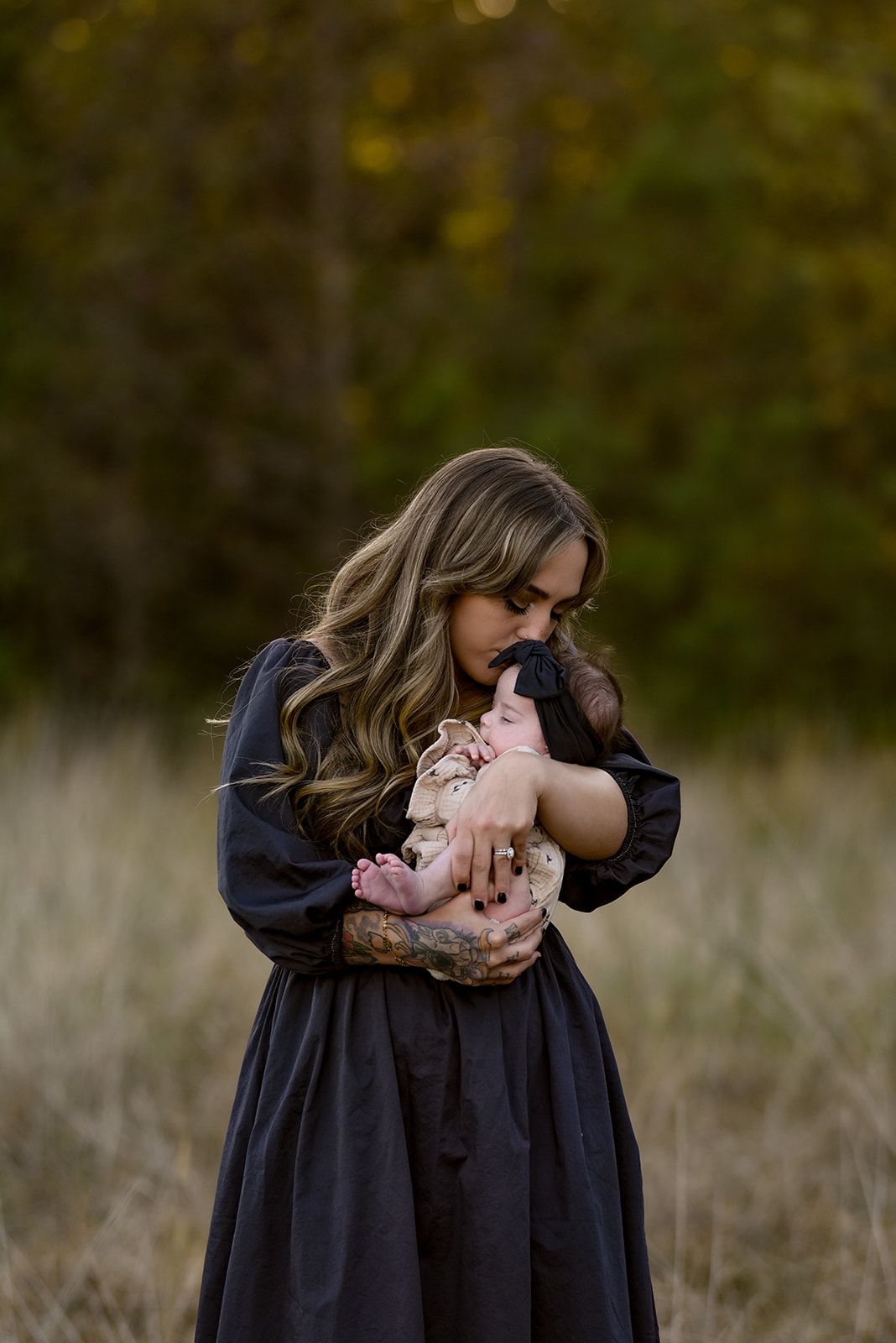 Father lifting child in open field near Cisco Georgia, genuine laugh captured during family session