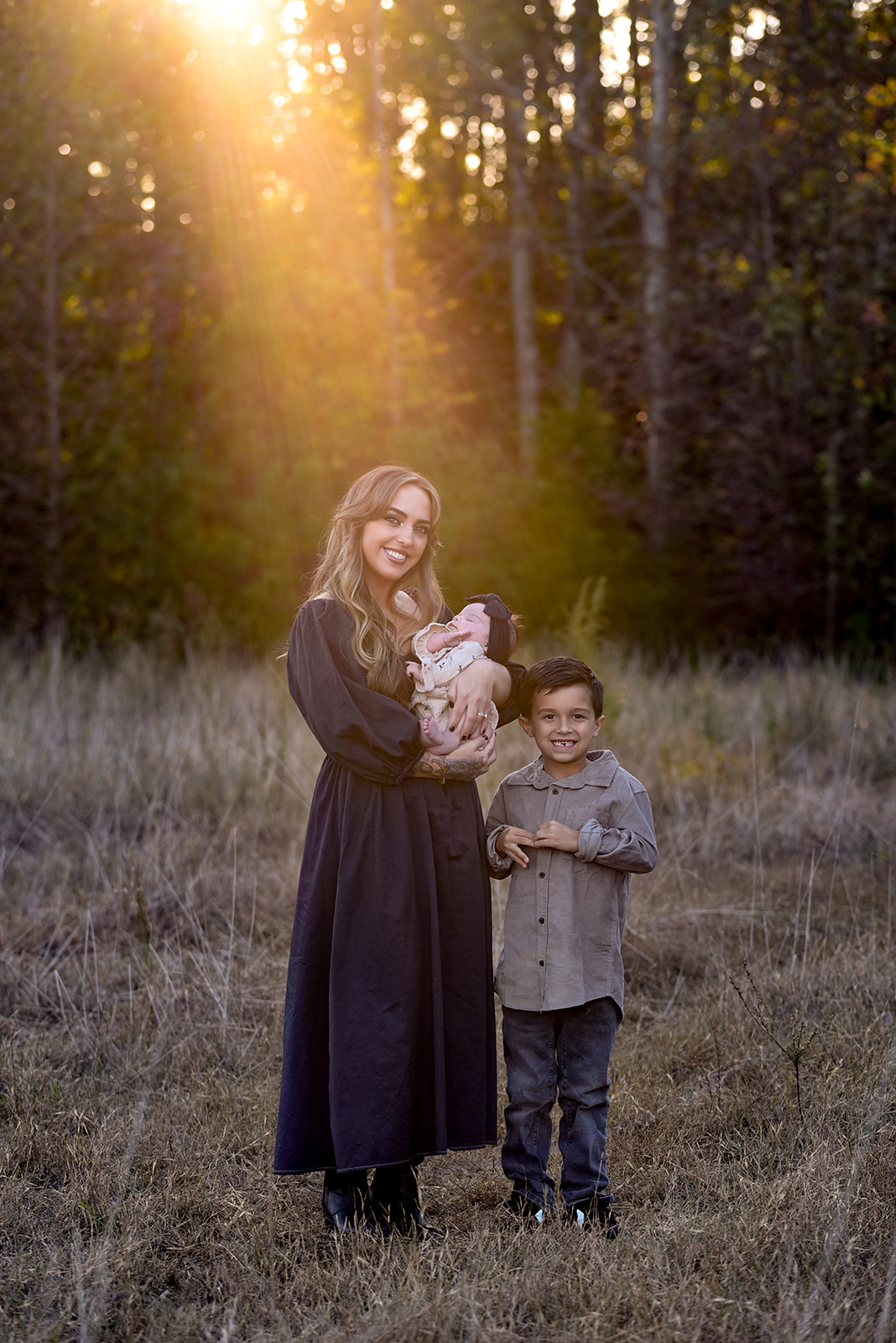 Family together in Coosawattee River bottomland, dappled light and genuine interaction, Gordon County Georgia