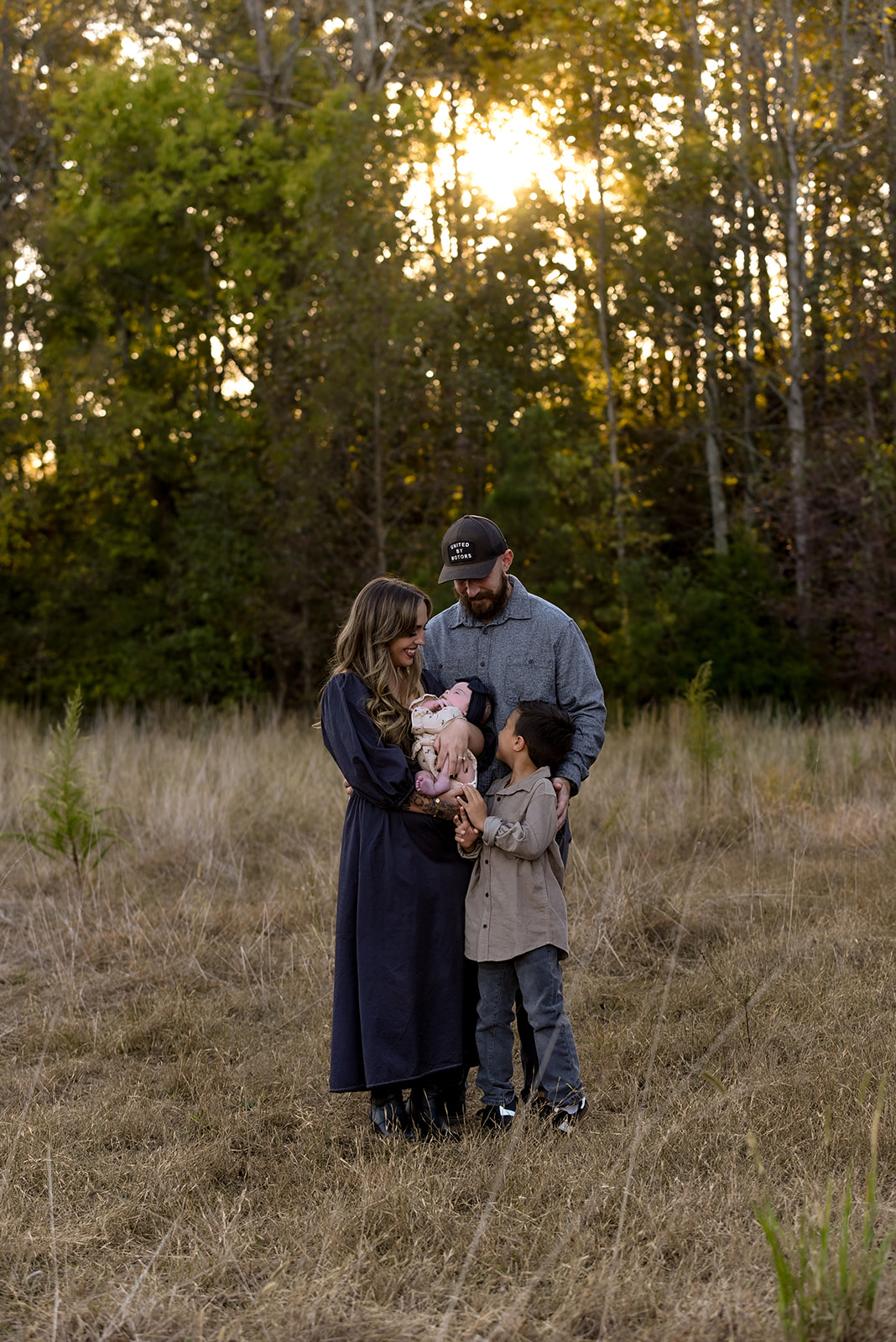 Family session near Cisco Georgia, Coosawattee River corridor, warm golden light on open farmland