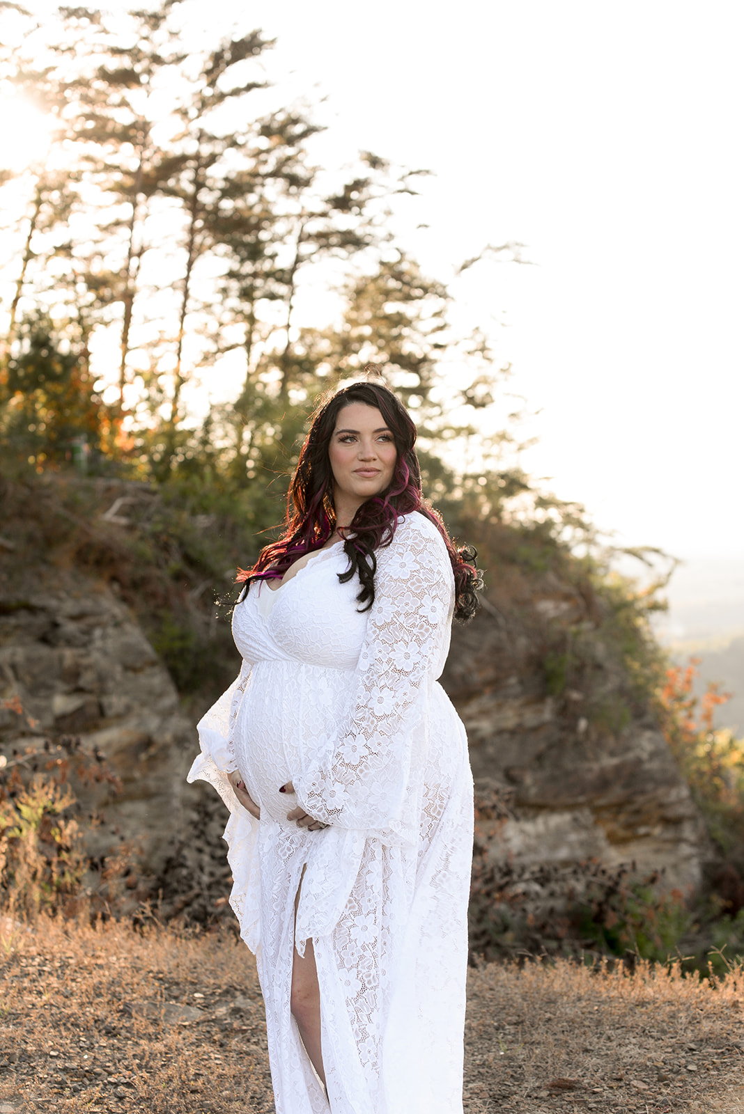 Maternity portrait at sunset near Jasper GA, warm golden light over North Georgia foothills