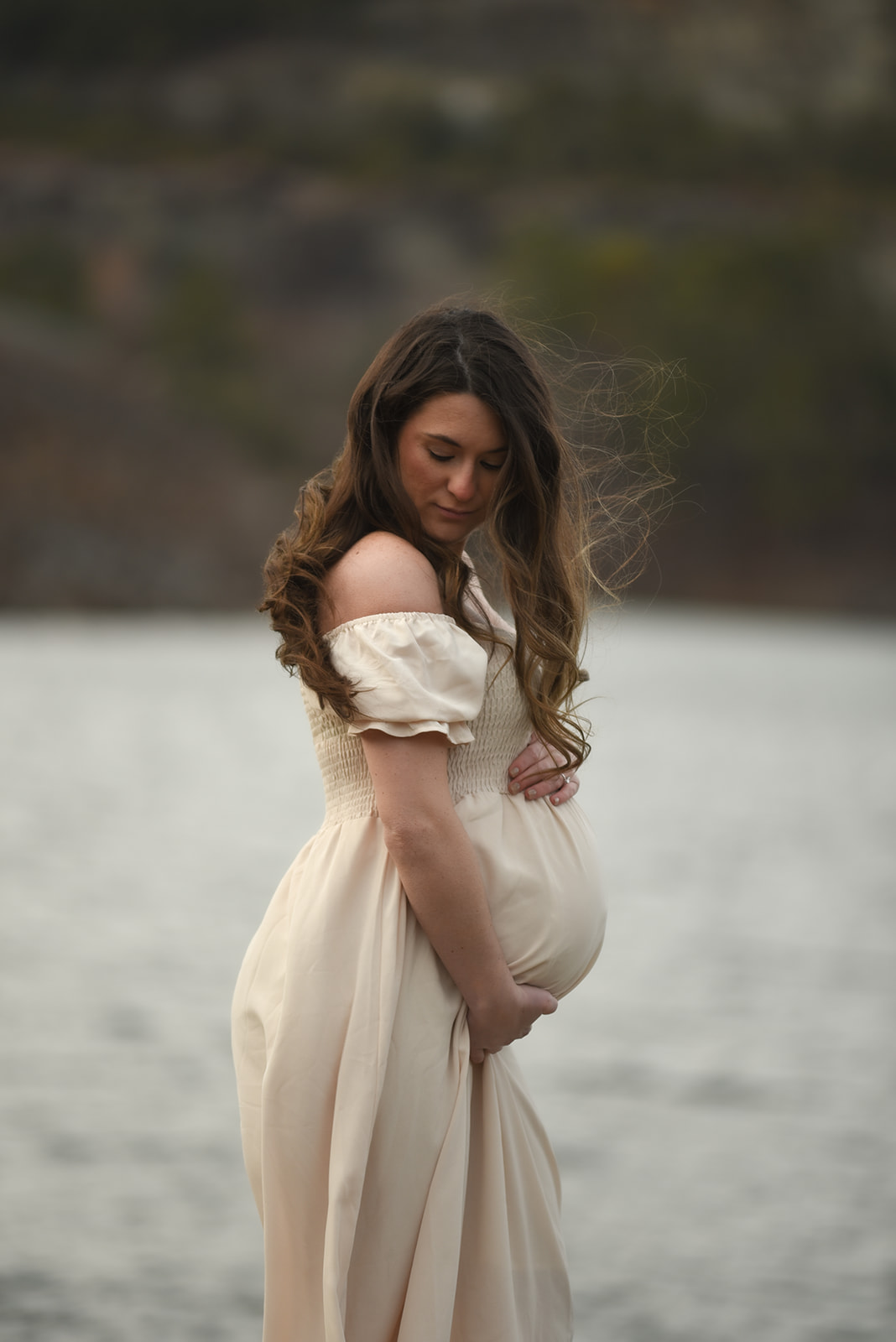 Maternity portrait in North Georgia mountains near Ellijay, soft evening light and mountain backdrop
