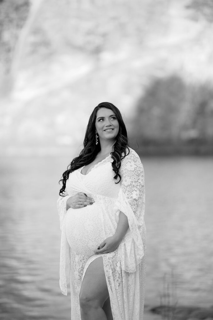 Black and white maternity portrait of expecting mother during outdoor session in Georgia