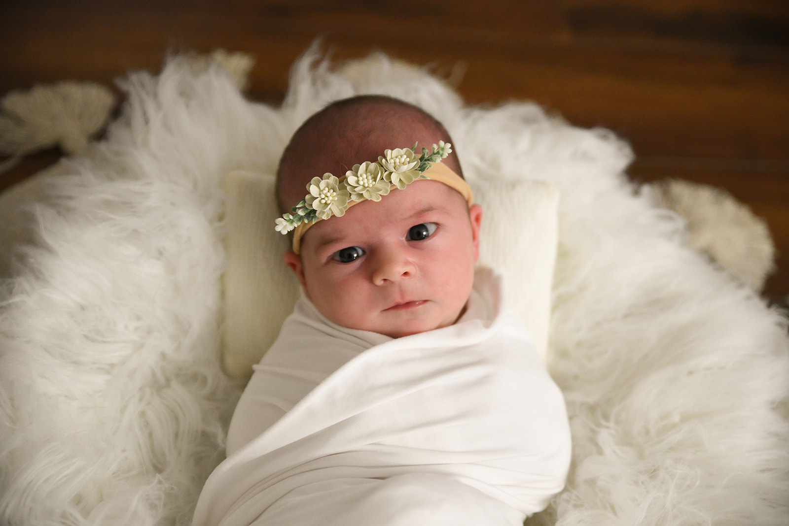 Newborn sleeping in knit wrap prop, overhead portrait during Acworth GA newborn session