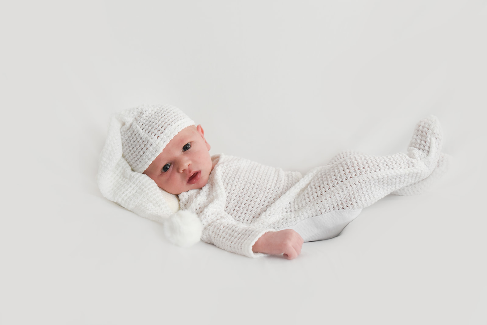 Newborn photography session in Roswell GA with natural window light and real home setting