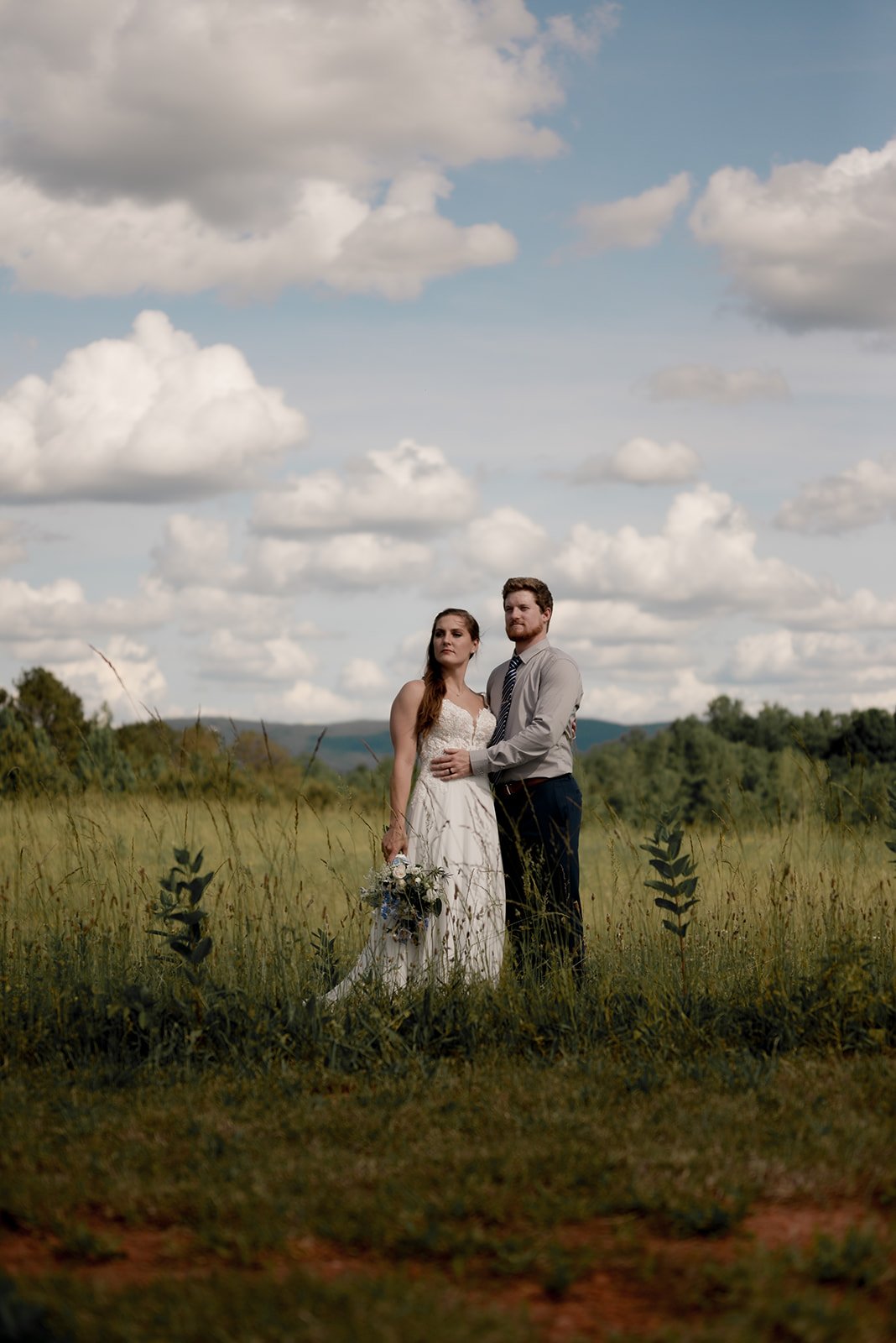 North Georgia mountain wedding portrait at dusk, couple silhouetted against fading ridge light